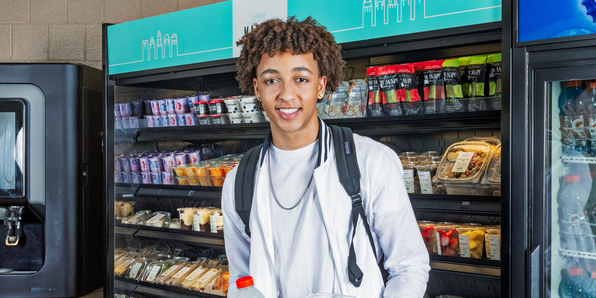 Student standing in middle of c-store